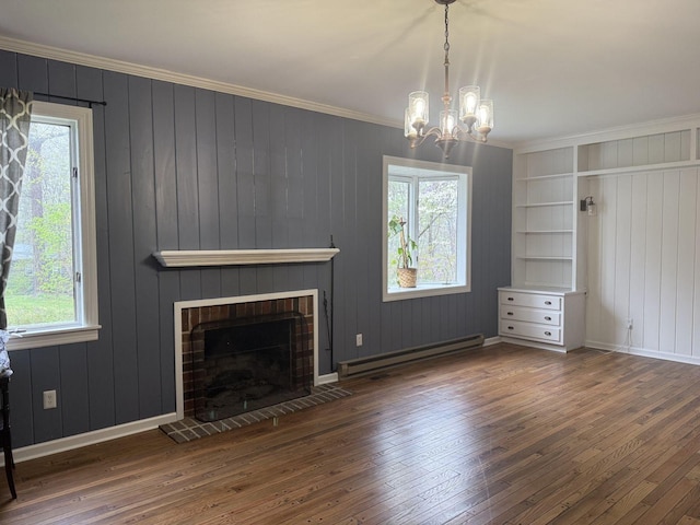 236 N Carolina Ave, Sewanee, TN 37375 - unfurnished living room with a baseboard heating unit, wood-type flooring, plenty of natural light, and ornamental molding