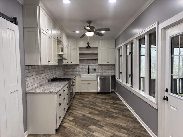 236 N Carolina Ave, Sewanee, TN 37375 - kitchen featuring stainless steel appliances, open shelves, decorative backsplash, a ceiling fan, and white cabinetry
