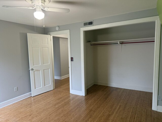 236 N Carolina Ave, Sewanee, TN 37375 - unfurnished bedroom featuring a closet, wood finished floors, and ceiling fan