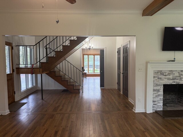 236 N Carolina Ave, Sewanee, TN 37375 - unfurnished living room featuring stairway, hardwood / wood-style flooring, ornamental molding, a chandelier, and a fireplace