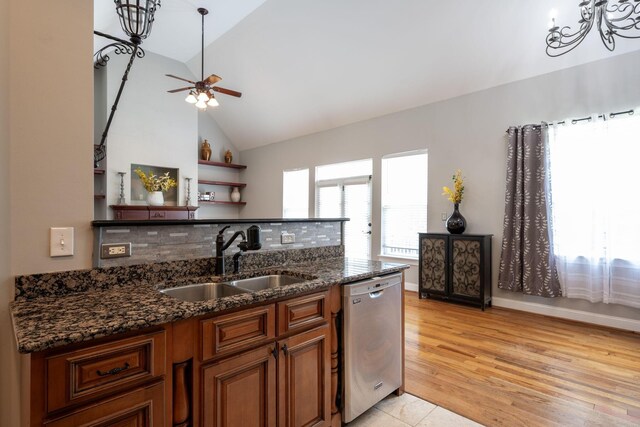 6853 Manassas Gap Ln, Hixson, TN 37343 - kitchen featuring stainless steel dishwasher, brown cabinetry, ceiling fan, dark stone countertops, and backsplash