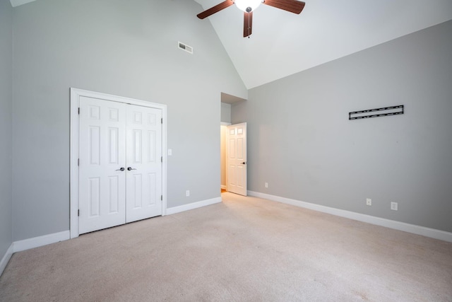 6853 Manassas Gap Ln, Hixson, TN 37343 - unfurnished bedroom featuring light carpet, high vaulted ceiling, ceiling fan, and a closet