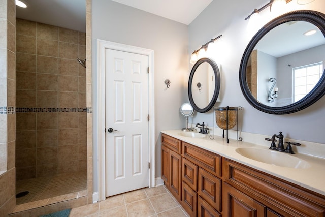6853 Manassas Gap Ln, Hixson, TN 37343 - bathroom featuring double vanity, a tile shower, and tile patterned floors