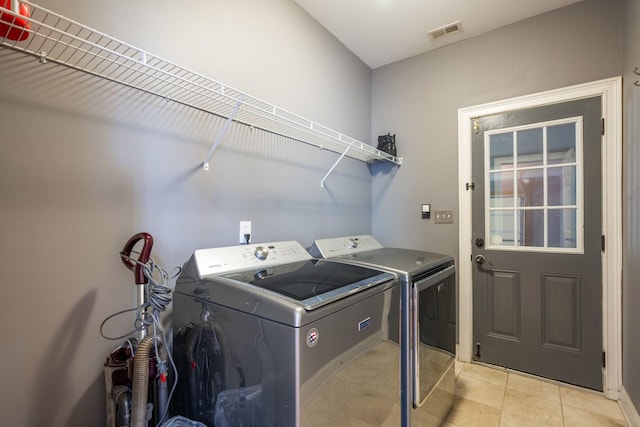6853 Manassas Gap Ln, Hixson, TN 37343 - laundry room with washing machine and clothes dryer and light tile patterned floors