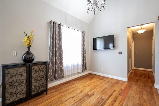 6853 Manassas Gap Ln, Hixson, TN 37343 - interior space with wood-type flooring, vaulted ceiling, and a chandelier