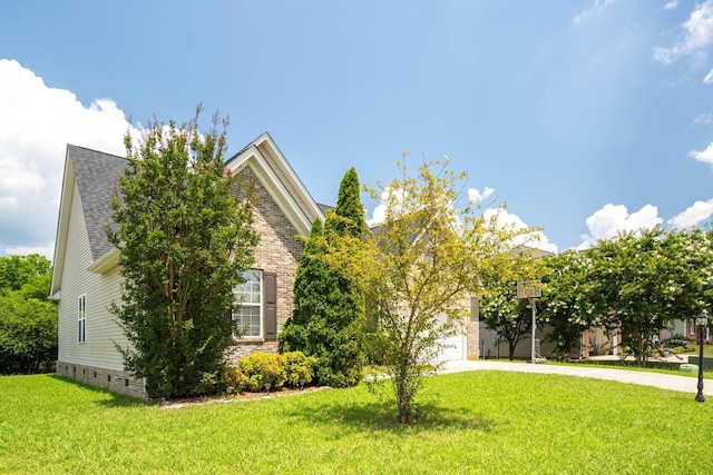 6853 Manassas Gap Ln, Hixson, TN 37343 - view of front of property with concrete driveway, a front lawn, an attached garage, and roof with shingles