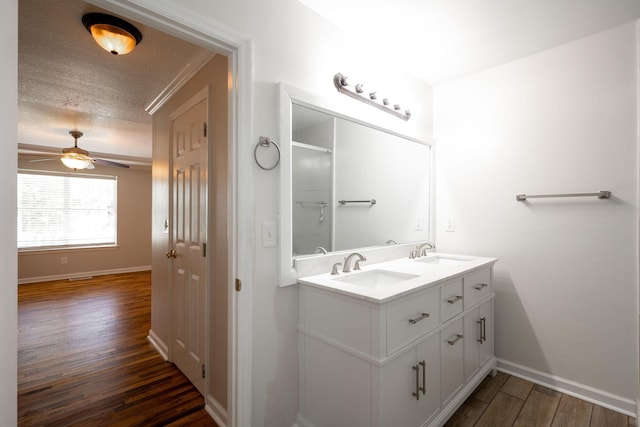 270 Autumn Trl, Ringgold, GA 30736 - full bath featuring wood finished floors, double vanity, a ceiling fan, and a textured ceiling