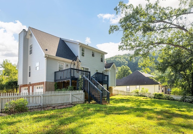 270 Autumn Trl, Ringgold, GA 30736 - back of property with stairway, a deck, an attached garage, roof with shingles, and brick siding