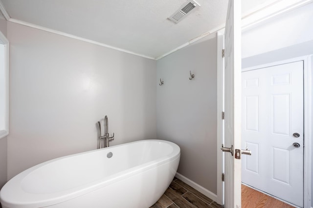 270 Autumn Trl, Ringgold, GA 30736 - bathroom with a soaking tub, wood finished floors, and crown molding