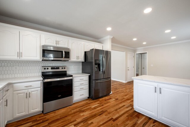 270 Autumn Trl, Ringgold, GA 30736 - kitchen with appliances with stainless steel finishes, crown molding, white cabinets, backsplash, and light wood-style flooring