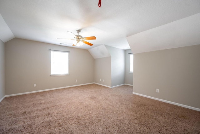 270 Autumn Trl, Ringgold, GA 30736 - additional living space with vaulted ceiling, light carpet, and ceiling fan