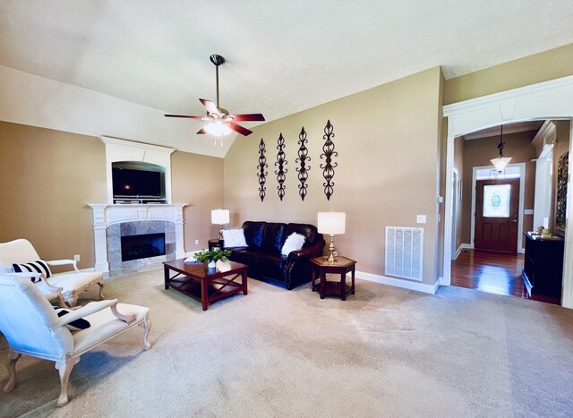 2714 Maylon Dr, Murfreesboro, TN 37128 - living area featuring carpet floors, a ceiling fan, a tile fireplace, and vaulted ceiling