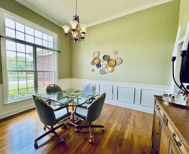 2714 Maylon Dr, Murfreesboro, TN 37128 - dining space with crown molding, a chandelier, healthy amount of natural light, wood finished floors, and a wainscoted wall
