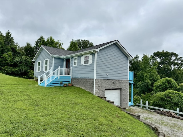 465 Turtle Point Ln, Waverly, TN 37185 - view of side of home featuring an attached garage, a yard, and a shingled roof