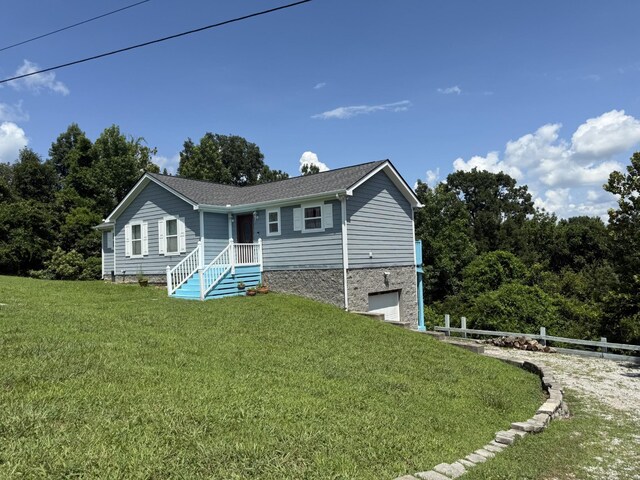 465 Turtle Point Ln, Waverly, TN 37185 - ranch-style home with a garage and roof with shingles