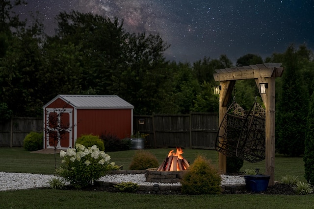 108 Larry Joe Pl, Portland, TN 37148 - view of yard with an outdoor fire pit and a storage shed