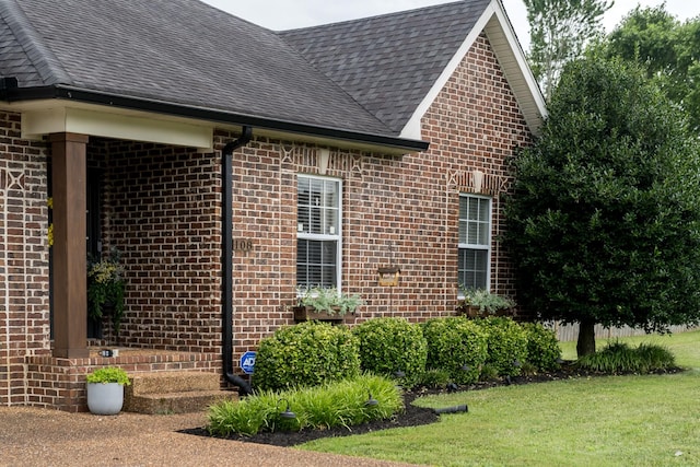 108 Larry Joe Pl, Portland, TN 37148 - view of side of property featuring brick siding, a shingled roof, and a lawn