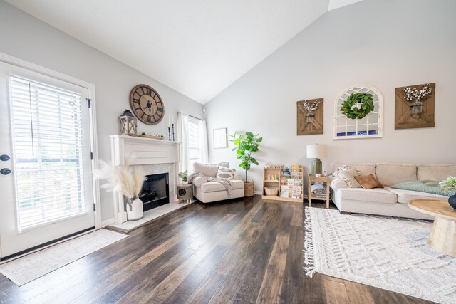 108 Larry Joe Pl, Portland, TN 37148 - living room with high vaulted ceiling, a fireplace, and dark wood finished floors