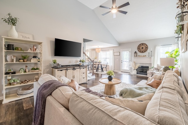 108 Larry Joe Pl, Portland, TN 37148 - living area with high vaulted ceiling, a ceiling fan, wood finished floors, a premium fireplace, and stairs