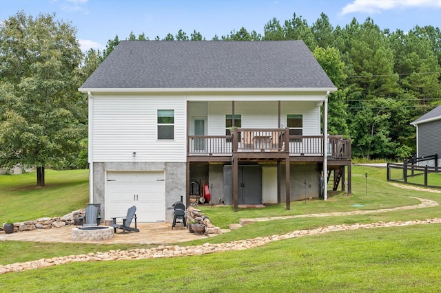 3767 Lee Pike, Soddy Daisy, TN 37379 - back of house featuring an outdoor fire pit, a deck, an attached garage, driveway, and roof with shingles