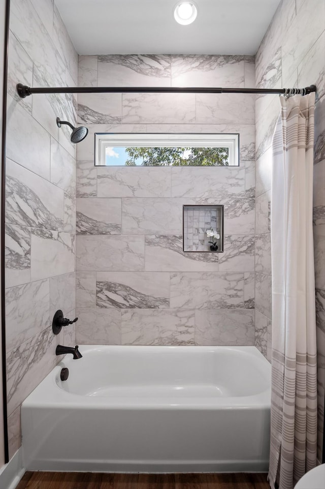 3767 Lee Pike, Soddy Daisy, TN 37379 - bathroom featuring shower / bathtub combination with curtain and wood finished floors