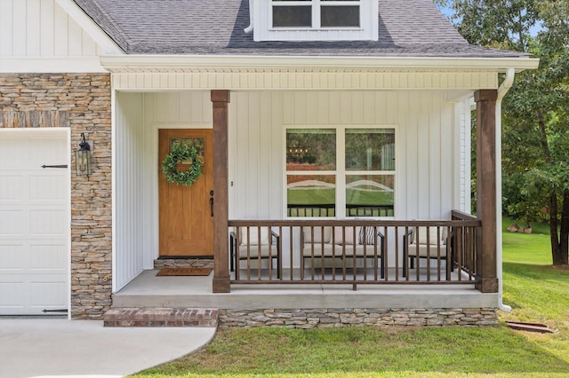 3767 Lee Pike, Soddy Daisy, TN 37379 - doorway to property featuring stone siding, covered porch, a shingled roof, and a garage