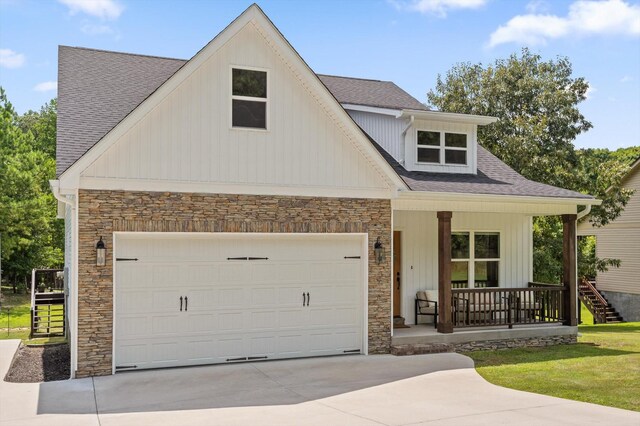3767 Lee Pike, Soddy Daisy, TN 37379 - view of front of property featuring stone siding, covered porch, driveway, and a shingled roof