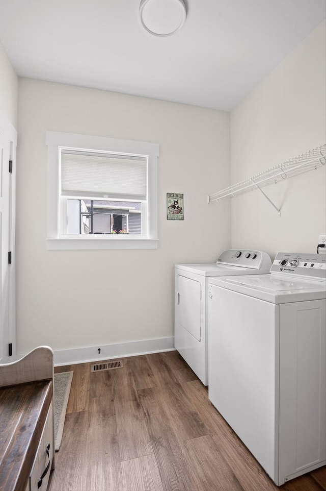 3767 Lee Pike, Soddy Daisy, TN 37379 - laundry area with washing machine and dryer and wood finished floors