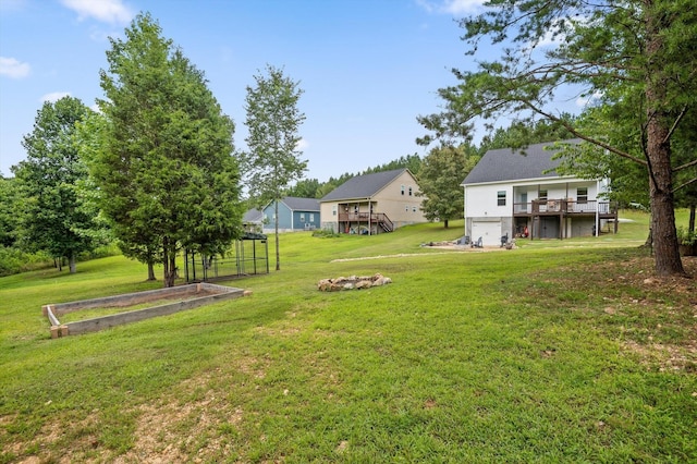 3767 Lee Pike, Soddy Daisy, TN 37379 - view of green lawn featuring a deck and a garden