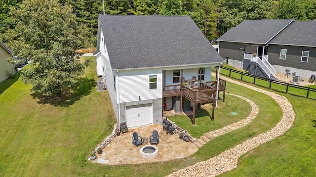 3767 Lee Pike, Soddy Daisy, TN 37379 - back of house featuring roof with shingles, a wooden deck, an attached garage, stairs, and a fire pit