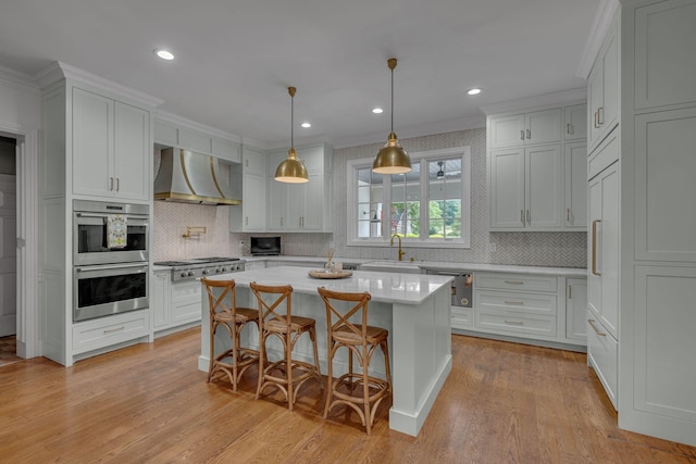 2485 Old Natchez Trce, Franklin, TN 37069 - kitchen with under cabinet range hood, crown molding, stainless steel appliances, tasteful backsplash, and light wood-type flooring