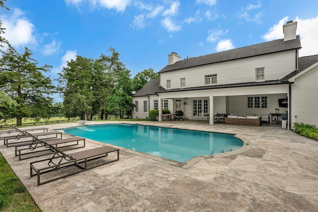 2485 Old Natchez Trce, Franklin, TN 37069 - swimming pool featuring french doors, a patio area, and an outdoor living space