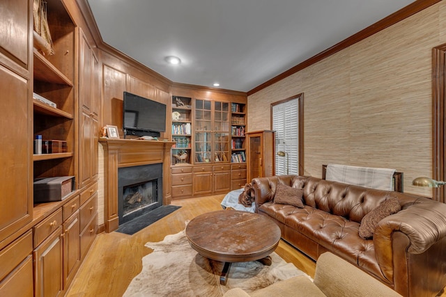 2485 Old Natchez Trce, Franklin, TN 37069 - living room with crown molding, light wood finished floors, a fireplace with flush hearth, wallpapered walls, and built in features