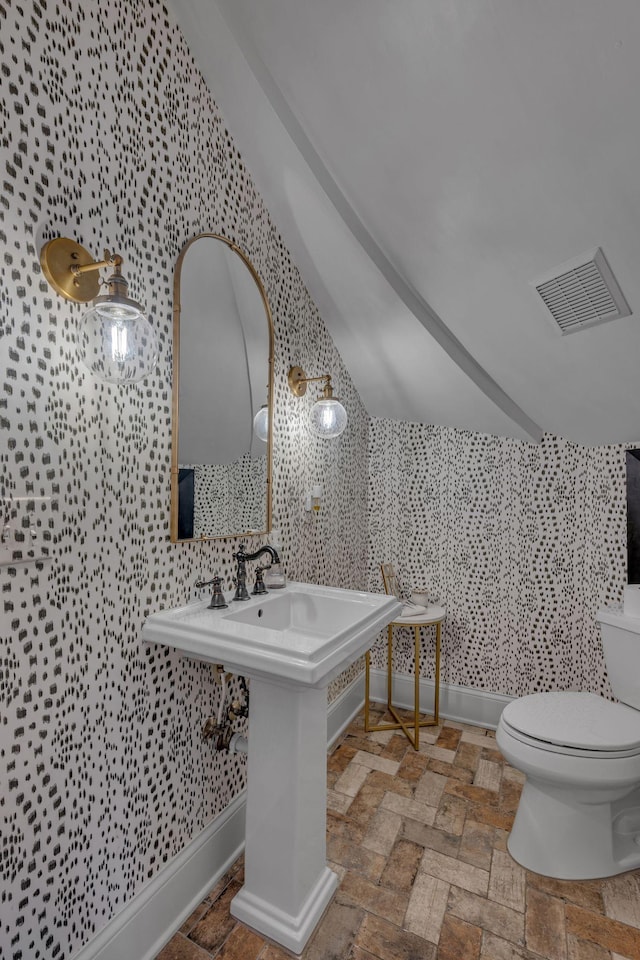 2485 Old Natchez Trce, Franklin, TN 37069 - bathroom with wallpapered walls and stone finish flooring