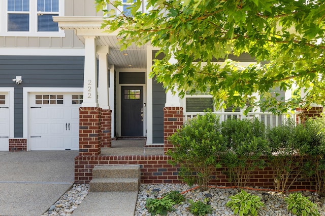 222 Fowler Cir, Franklin, TN 37064 - entrance to property with brick siding, board and batten siding, and a garage