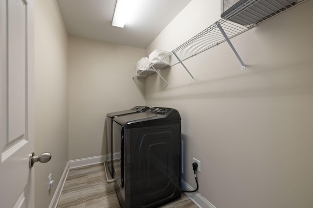 222 Fowler Cir, Franklin, TN 37064 - laundry room featuring independent washer and dryer and wood finished floors