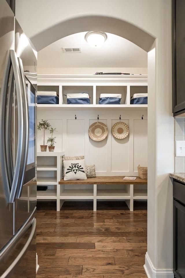 222 Fowler Cir, Franklin, TN 37064 - mudroom featuring dark wood finished floors and arched walkways