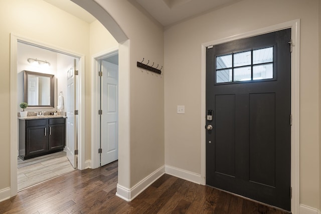222 Fowler Cir, Franklin, TN 37064 - entryway featuring arched walkways and dark wood finished floors