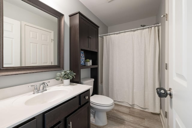 222 Fowler Cir, Franklin, TN 37064 - bathroom featuring vanity, wood finished floors, and shower / tub combo with curtain