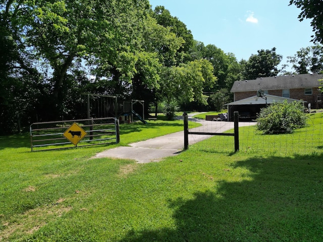 3349 Sweeney Hollow Rd, Franklin, TN 37064 - view of property's community featuring a playground, a lawn, and a gate