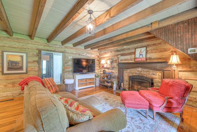 9710 Concord Rd, Brentwood, TN 37027 - living room with beam ceiling, hardwood / wood-style flooring, wood walls, and a stone fireplace