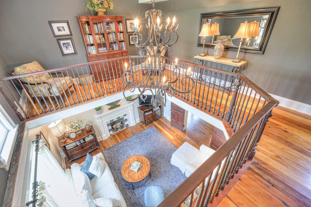 9710 Concord Rd, Brentwood, TN 37027 - stairs with a chandelier and hardwood / wood-style flooring