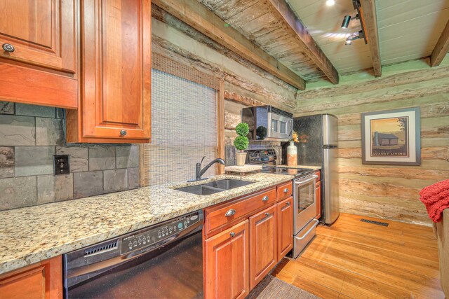 9710 Concord Rd, Brentwood, TN 37027 - kitchen featuring appliances with stainless steel finishes, light stone countertops, light wood-type flooring, backsplash, and a wood ceiling with exposed beams