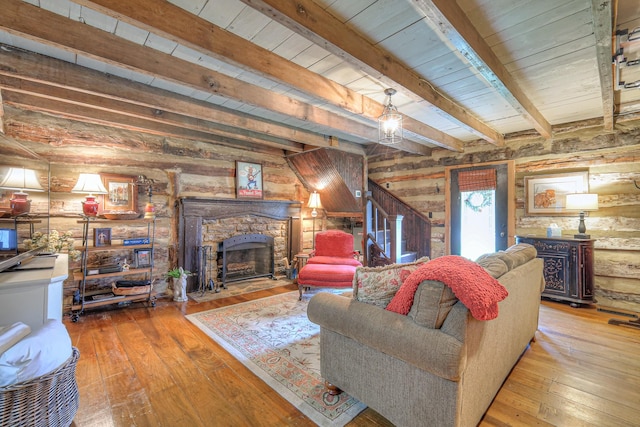 9710 Concord Rd, Brentwood, TN 37027 - living area with a stone fireplace, wood-type flooring, a wood ceiling with exposed beams, and wooden walls