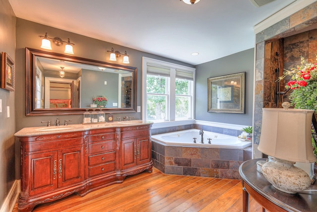 9710 Concord Rd, Brentwood, TN 37027 - bathroom featuring hardwood / wood-style floors, a garden tub, and double vanity