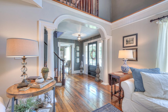 9710 Concord Rd, Brentwood, TN 37027 - entrance foyer with decorative columns, hardwood / wood-style floors, stairway, and arched walkways