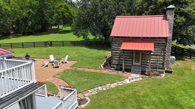 9710 Concord Rd, Brentwood, TN 37027 - fenced backyard featuring an outdoor fire pit and a wooden deck