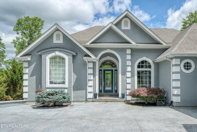 145 Pineridge Loop, Crossville, TN 38558 - doorway to property with stucco siding and a shingled roof