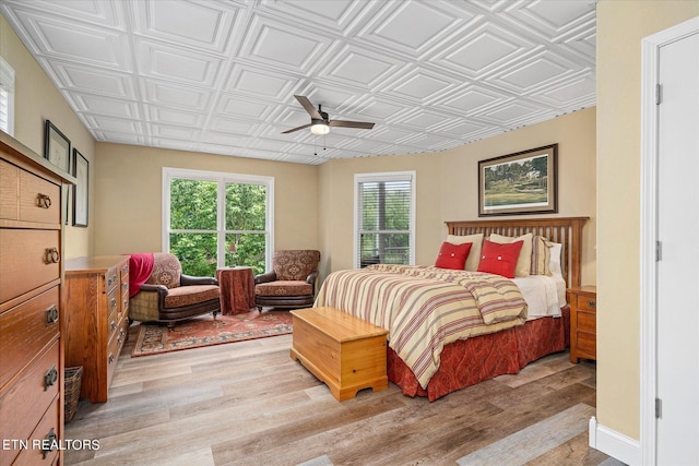 145 Pineridge Loop, Crossville, TN 38558 - bedroom with an ornate ceiling, light wood-style floors, and a ceiling fan