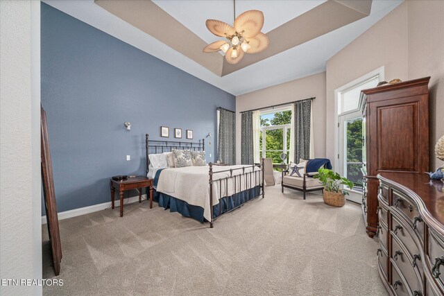 145 Pineridge Loop, Crossville, TN 38558 - bedroom with light colored carpet, a ceiling fan, and a raised ceiling